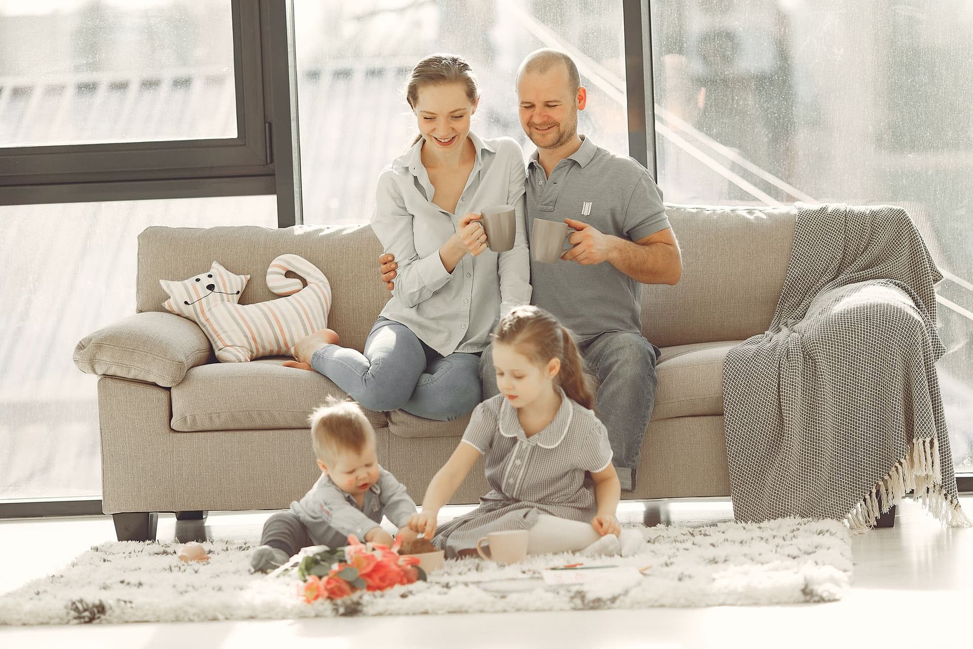 A family enjoying a sunlit morning together at home